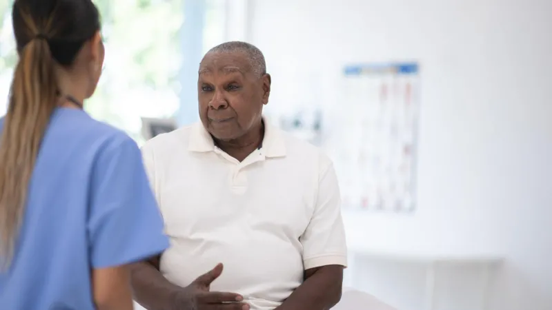 UK Expands Prostate Cancer Screening Trial for Black Men Major step in targeted prostate cancer checks The UK government has expanded a prostate cancer screening trial to include tens of thousands of black men aged 45 to 74. These men will be invited for testing to help improve early detection methods for the disease. Health officials say the aim is to find better ways of identifying prostate cancer earlier, especially in high risk groups. Black men face a much higher risk, with studies showing their lifetime chance of developing prostate cancer is about one in four. Why black men are being prioritised Prostate cancer remains the most common cancer among men in the UK. Around 64,000 men receive a diagnosis each year, and about 12,000 die from the disease. Medical data shows black men face double the risk compared to other groups. Because of this, researchers are focusing on targeted screening to close the gap in outcomes and improve survival rates. What the screening trial includes The government has committed £18 million to support the Transform trial. The study will test whether combining different methods improves accuracy. Participants may receive: PSA blood tests to detect prostate specific antigen levels Genetic testing to identify higher risk variants Faster MRI scans for more detailed imaging Researchers hope this combined approach will reduce missed cases and improve early diagnosis. Debate over routine screening Health experts continue to debate routine screening for all men. The UK National Screening Committee recently advised against regular PSA testing for most men without symptoms. They argue that PSA screening can lead to unnecessary treatment. Some prostate cancers grow slowly and may never cause harm. However, treatment can still lead to serious side effects such as bladder control problems and erectile dysfunction. For now, men are still encouraged to speak with a doctor if they notice symptoms like difficulty urinating. A step toward better future screening Officials believe the expanded trial will help shape a more accurate national screening system in the future. Health leaders say the focus is now on improving precision rather than broad testing. A health spokesperson said the programme is designed to focus on those most at risk and strengthen research to close evidence gaps. Readability and SEO Impro