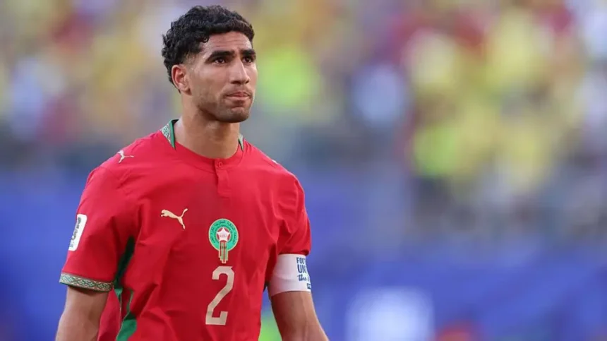 Trial Confirmed in France Morocco captain and Paris Saint Germain defender Achraf Hakimi will face trial in France after prosecutors confirmed the case will proceed. French authorities say the case involves an allegation from 2023, when a 24 year old woman accused him of rape at his home in Paris. An investigating judge ordered the trial in February 2026 after a long legal process that started in March 2023. Hakimi has denied all accusations from the beginning. He recently lost an appeal to stop the trial from going ahead, according to French media reports. Hakimi Responds Publicly Hakimi spoke on social media and rejected the allegations again. He said he has waited for years to present his side in court. He also claimed the case has affected his family and reputation. He added that he believes the justice process will allow him to speak openly and clear his name in court. Complainant Legal Position The lawyer for the woman involved said the court decision brings relief after years of legal proceedings. She said her client now has the chance to be heard properly in court. She also said the trial may support wider efforts to address sexual violence and challenge denial in professional sport environments. Football and World Cup Context Hakimi remains part of the Morocco national squad Morocco national football team and is expected to lead the team in upcoming matches. Morocco are currently playing World Cup fixtures in the United States. There are possible travel complications depending on where matches are held, since the tournament is co hosted by the United States, Canada, and Mexico. Earlier in the tournament, Thomas Partey missed a match after being denied entry to Canada while facing separate legal charges. Career Background Hakimi made his international debut in 2016 at the age of 17. He played a key role in Morocco reaching the World Cup semi finals in 2022, the first African team to do so. At club level, he joined Paris Saint Germain in 2021 and has won multiple trophies, including major European titles during his career.