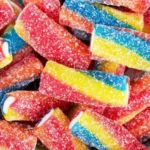 Candy Stores Are Growing in NYC Despite Economic Pressure Why small sweet shops are expanding during tough times New candy shops are appearing across New York City even though many retailers are struggling due to weak consumer confidence and ongoing inflation. While people are cutting back on larger purchases, demand for small treats like candy remains steady. Industry owners say sweets continue to sell because they are affordable and offer quick comfort. Even during financial stress, customers still want small indulgences they can easily justify. A business model that survived the Great Depression One of the strongest examples is Economy Candy on Manhattan’s Lower East Side. It first opened in 1937 during the tail end of the Great Depression and is now known as the city’s oldest candy store. The shop did not start as a candy store. It began as a hat and shoe repair business, with candy sold outside on a small cart to earn extra income. Over time, repairs became less affordable for customers, so the family shifted fully to sweets. That decision helped the business survive, and it is still running today under third generation ownership. Why candy still sells in uncertain times Owner Mitchell Cohen says people still buy candy even when money feels tight. He explains that inflation and uncertainty reduce spending power, but candy remains an easy and low cost purchase. Recent retail data shows overall US sales are still rising, yet consumer sentiment has dropped to record lows. This gap reflects a split between what people feel and what they still spend on. Experts say candy fits into a pattern often called the “lipstick effect.” When budgets shrink, people avoid expensive items but still buy small luxuries that give emotional comfort. New shops are betting on small treats This trend is also attracting new entrepreneurs. Kate Bolger, a former movie producer, is preparing to open The Village Confectionery in Sleepy Hollow, a town near New York City known for its literary history. Bolger believes customers may delay big purchases but will still spend on small treats like candy. She sees it as a simple way for people to enjoy something small without financial strain. A small luxury that stays resilient Even as the wider retail sector faces pressure, candy stores continue to grow in select areas. Their success is linked to low prices, emotional appeal, and steady demand during uncertain economic conditions.