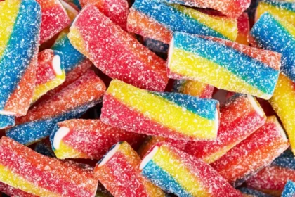 Candy Stores Are Growing in NYC Despite Economic Pressure Why small sweet shops are expanding during tough times New candy shops are appearing across New York City even though many retailers are struggling due to weak consumer confidence and ongoing inflation. While people are cutting back on larger purchases, demand for small treats like candy remains steady. Industry owners say sweets continue to sell because they are affordable and offer quick comfort. Even during financial stress, customers still want small indulgences they can easily justify. A business model that survived the Great Depression One of the strongest examples is Economy Candy on Manhattan’s Lower East Side. It first opened in 1937 during the tail end of the Great Depression and is now known as the city’s oldest candy store. The shop did not start as a candy store. It began as a hat and shoe repair business, with candy sold outside on a small cart to earn extra income. Over time, repairs became less affordable for customers, so the family shifted fully to sweets. That decision helped the business survive, and it is still running today under third generation ownership. Why candy still sells in uncertain times Owner Mitchell Cohen says people still buy candy even when money feels tight. He explains that inflation and uncertainty reduce spending power, but candy remains an easy and low cost purchase. Recent retail data shows overall US sales are still rising, yet consumer sentiment has dropped to record lows. This gap reflects a split between what people feel and what they still spend on. Experts say candy fits into a pattern often called the “lipstick effect.” When budgets shrink, people avoid expensive items but still buy small luxuries that give emotional comfort. New shops are betting on small treats This trend is also attracting new entrepreneurs. Kate Bolger, a former movie producer, is preparing to open The Village Confectionery in Sleepy Hollow, a town near New York City known for its literary history. Bolger believes customers may delay big purchases but will still spend on small treats like candy. She sees it as a simple way for people to enjoy something small without financial strain. A small luxury that stays resilient Even as the wider retail sector faces pressure, candy stores continue to grow in select areas. Their success is linked to low prices, emotional appeal, and steady demand during uncertain economic conditions.