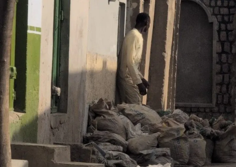 Nigerian Man Jailed After Storing Human Waste Outside Home Court action taken after neighbours report severe smell in Kano A man in northern Nigeria has been jailed for two weeks after neighbours complained that he kept bags of human waste outside his home, causing a strong and unbearable smell in the area. The case was heard in the city of Kano after residents alerted environmental officials about the situation. Authorities later took Mohammed Saidu to court over public health concerns linked to the stored waste. Neighbours raised alarm over health and smell Residents said the odour from the property made daily life difficult. Some reported that they could not sit outside or relax in their homes because of the smell. One neighbour, Samaila Inuwa, said people first tried to resolve the issue directly with Saidu. He added that the warnings were ignored and the situation continued. Local chief Musa Abdullahi also said he was informed early on and spoke to Saidu after the first complaints. He said the waste was removed at one point, but later returned. Waste linked to fertiliser practice Saidu works emptying septic tanks. He is believed to have stored the waste for resale to farmers, where human waste is sometimes used as fertiliser in the region. The practice exists in some areas but is rarely discussed openly. Reports suggest nearly 50 bags of waste were seen at the property when complaints were first raised. Court ruling and penalty Saidu admitted in court to the charge of endangering public health. A magistrate visited the site before issuing the ruling and ordered that the waste be removed completely. He was sentenced to 14 days in prison and fined 100,000 naira, equal to about 55 dollars. The court also warned him not to repeat the act. Authorities said the situation improved after the case was taken to court, with residents reporting that the smell had stopped and normal life had returned.