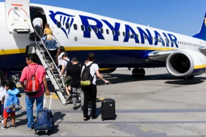 UK regulator investigates Ryanair over charges for parents to sit with children on flights, examining fairness, pricing transparency,
