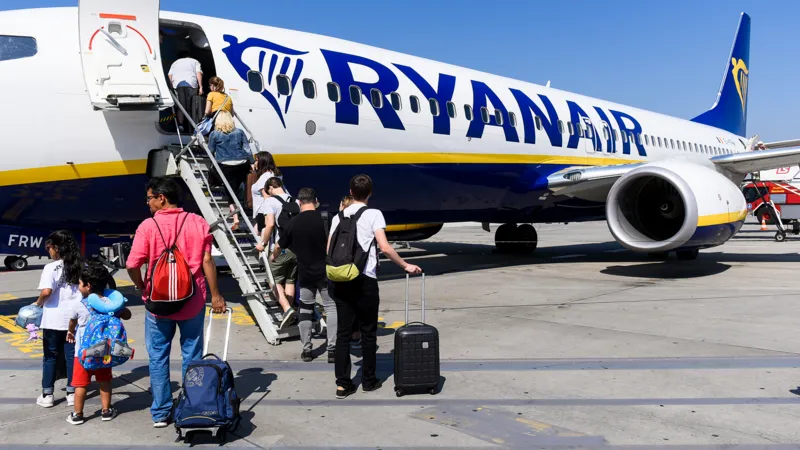 UK regulator investigates Ryanair over charges for parents to sit with children on flights, examining fairness, pricing transparency,