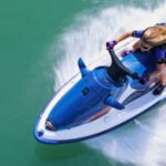 Jet Ski Speeding and Safety Concerns at Conwy Harbour Dangerous Speeds Reported on Water Jet skiers have been recorded travelling at extreme speeds in Conwy Harbour. Reports show some riders reaching up to 30 or 40 knots, which is around three to four times the local 10 knot speed limit. Authorities say children have been seen on board during these high speed runs. This has raised serious safety concerns for other water users in the area. Efforts to Control Reckless Activity Conwy council has installed CCTV cameras to monitor activity in the harbour. The system is meant to help identify those breaking speed rules. However, enforcement has faced challenges. Some riders have removed registration plates to avoid being identified. This has made it harder to take action against offenders. Harbour officials say this behaviour appears planned, as it suggests awareness of camera coverage in the area. High Risk Area Identified Officials have highlighted a narrow section of water between Deganwy and the navigation beacons as the most problematic zone. This area is heavily used and leaves little room for error at high speed. Clear warning signs are placed at key points around the harbour, including slipways and marina exits. Yellow marker buoys also indicate the speed restricted zone. Safety Concerns Raised by Harbour Authorities The Harbour Master has described repeated cases of dangerous behaviour in recent months. He stressed that only a small number of users are responsible, but their actions put others at risk. Authorities say they are still working on gathering stronger evidence. They want to link speeding incidents with vessel launch points before taking formal action. Steps Being Taken Officials are improving warning signage to make speed limits clearer. They are also working with CCTV teams to record incidents in real time. Plans for further enforcement are still in development as authorities try to close gaps that allow offenders to avoid penalties.