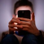 The UK government has asked major tech companies to improve safety controls on smartphones used by children. The main goal is to stop minors from taking, sending, or viewing nude images on their devices. Keir Starmer said companies must act quickly by using existing tools or updating their systems. The request targets major platforms such as Apple and Google. Government Push for Stronger Child Safety The government wants tech firms to activate stronger protections for children within three months. These protections should work across smartphones and tablets used in the UK. If companies fail to comply, new laws may follow. These laws could include financial penalties. In serious cases, companies could face legal responsibility. Officials also said the rules would apply to both new and already sold devices. Adults would not be affected if they verify their age correctly. How the System Could Work Some safety tools already exist on modern devices. Apple offers a Communication Safety feature. It can detect nude images in messages and warn children before they send or receive them. It works in apps like Messages, AirDrop, and FaceTime. Google Messages can blur sensitive content for users under parental supervision. It also reduces exposure to harmful images on Android devices. Some companies are also testing artificial intelligence tools that detect and block explicit images directly on devices. The government has highlighted these tools as possible solutions for wider use. Privacy and Safety Concerns Not everyone agrees on how far these controls should go. Some experts worry that stronger restrictions could affect user privacy. They believe age checks for adults or system wide scanning could create new risks. Others argue that stronger action is necessary to protect children from grooming and sextortion online. Existing Laws and Ongoing Debate The UK already has online safety rules under the Online Safety Act. These rules require platforms to take responsibility for harmful content. Even with these laws, campaigners say more action is needed. They believe children are still exposed to harmful content through messaging apps and social platforms.