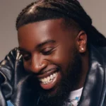Grammy winning songwriter Talay Riley, real name Mark Orabiyi, died after a stabbing in east London. Artists including Stormzy and Wretch 32 paid tribute.