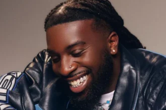 Grammy winning songwriter Talay Riley, real name Mark Orabiyi, died after a stabbing in east London. Artists including Stormzy and Wretch 32 paid tribute.