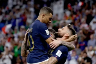 Olivier Giroud and Kylian Mbappe friendship behind France goal record Record broken, respect remains Olivier Giroud reflected on the moment his France goal scoring record was surpassed by Kylian Mbappe. Mbappe reached 58 goals for Les Bleus after scoring against Senegal, moving past Giroud to become France all time top scorer. Giroud said he messaged Mbappe right after the match. He congratulated him and expressed happiness for his achievement. He also joked about keeping the competition alive and reminded Mbappe about a promised shirt exchange. Mbappe acknowledged the message through a member of the coaching staff and said he would call Giroud soon. A shared promise and mutual admiration Giroud mentioned that Mbappe had already promised to give him the shirt he wore when he broke the record. He plans to ask again when they speak. Despite the rivalry on paper, Giroud emphasized there is strong respect between them. He said people often ask about their relationship, but the answer is simple. They share genuine admiration. The celebration that says it all Giroud pointed to a celebration photo from the 2022 World Cup match against Poland as the best reflection of their bond. In that match, Mbappe provided the assist for Giroud’s goal. Giroud scored, then celebrated with a knee slide toward the corner flag. Mbappe ran to him and jumped into his arms. Giroud recalled telling Mbappe that he loved him like a brother in that moment. He described it as a special memory that showed their connection beyond football. Passing the legacy forward Giroud said it feels meaningful that Mbappe now sits above him in France scoring history. He also noted that his name remains between Mbappe and Thierry Henry on the all time list, which he views with pride. He ended with a simple thought. Records change, but respect between players stays.