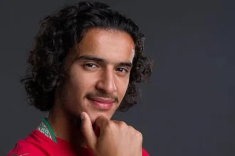 The young maths talent who became a football sensation and chose Morocco Early rise and growing reputation at club level Ayyoub Bouaddi is a young midfielder who has quickly built a strong reputation in European football. Coaches and teammates at Lille have long seen his potential and describe his rise as steady and expected rather than sudden. Olivier Giroud, a World Cup winner and teammate at Lille, has spoken highly of him. He compares Bouaddi’s maturity and mindset to top level players he has played with before, including Kylian Mbappe. Olivier Giroud Kylian Mbappe Inside the club, staff say Bouaddi’s progress has been consistent. His performances in training and matches have made him stand out across Ligue 1. Big stage impact against Brazil Bouaddi delivered a strong performance in his World Cup appearance for Morocco against Brazil. Morocco national football team Brazil national football team He controlled the midfield with confidence and energy. He had the highest involvement for Morocco, completing many passes and touching the ball often throughout the match. His dribbling helped Morocco move forward under pressure. Even late in the game, he kept driving the team up the pitch instead of slowing down. Defensively, he stayed active. He won several duels and challenged experienced players like Casemiro, who struggled to handle his intensity during the match. Why Morocco won the race for his choice Bouaddi was eligible to represent both France and Morocco. France national football team He played for France at youth levels, but his family roots played a major role in his final decision. He often expressed pride in his heritage and shared that connection publicly through a childhood image of him wearing a Morocco shirt. France and Morocco both showed strong interest in securing his future. Even senior figures around him tried to influence his decision. In the end, he chose Morocco because of personal identity and emotional connection rather than pressure from outside voices. Coaches and teammates were not surprised People who trained him early in Creil say his rise was predictable. His former coaches describe him as a player who regularly performs at a high level, not just in big matches but every week. They believe his World Cup display matched what he already shows in club football. In their view, his confidence on the big stage is a natural extension of his everyday performances.