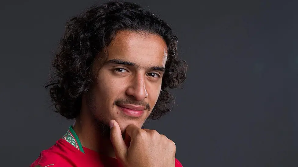 The young maths talent who became a football sensation and chose Morocco Early rise and growing reputation at club level Ayyoub Bouaddi is a young midfielder who has quickly built a strong reputation in European football. Coaches and teammates at Lille have long seen his potential and describe his rise as steady and expected rather than sudden. Olivier Giroud, a World Cup winner and teammate at Lille, has spoken highly of him. He compares Bouaddi’s maturity and mindset to top level players he has played with before, including Kylian Mbappe. Olivier Giroud Kylian Mbappe Inside the club, staff say Bouaddi’s progress has been consistent. His performances in training and matches have made him stand out across Ligue 1. Big stage impact against Brazil Bouaddi delivered a strong performance in his World Cup appearance for Morocco against Brazil. Morocco national football team Brazil national football team He controlled the midfield with confidence and energy. He had the highest involvement for Morocco, completing many passes and touching the ball often throughout the match. His dribbling helped Morocco move forward under pressure. Even late in the game, he kept driving the team up the pitch instead of slowing down. Defensively, he stayed active. He won several duels and challenged experienced players like Casemiro, who struggled to handle his intensity during the match. Why Morocco won the race for his choice Bouaddi was eligible to represent both France and Morocco. France national football team He played for France at youth levels, but his family roots played a major role in his final decision. He often expressed pride in his heritage and shared that connection publicly through a childhood image of him wearing a Morocco shirt. France and Morocco both showed strong interest in securing his future. Even senior figures around him tried to influence his decision. In the end, he chose Morocco because of personal identity and emotional connection rather than pressure from outside voices. Coaches and teammates were not surprised People who trained him early in Creil say his rise was predictable. His former coaches describe him as a player who regularly performs at a high level, not just in big matches but every week. They believe his World Cup display matched what he already shows in club football. In their view, his confidence on the big stage is a natural extension of his everyday performances.
