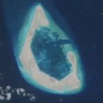 A rapidly changing landscape in the South China Sea Antelope Reef, located in the north west of the South China Sea, has changed beyond recognition. Until recently, it was mostly underwater and barely visible above the waves. Now it has become a newly formed island stretching around six square kilometres, built in just half a year. Satellite images show a bright white sand formation shaped like a crescent. Small structures have already appeared on one side. Inside the lagoon, a large number of vessels are operating, believed to be powerful dredging ships used to reshape the seabed. Massive dredging operations reshape reefs China operates one of the largest dredging fleets in the world. Some of these ships can move around 6,000 cubic metres of sand per hour. That is enough material to fill two Olympic sized swimming pools in a single hour. Millions of tonnes of sand have been extracted from the seabed to create solid ground. The speed of this transformation is among the fastest recorded for such projects. Regional powers expand their presence China is not acting alone in reshaping reefs in the region. Vietnam has also begun strengthening and expanding reefs under its control in response to earlier Chinese projects. The Philippines and other claimants are also carrying out smaller scale construction activities. These developments reflect growing competition over territory in the South China Sea. Disputed waters and rising tensions The South China Sea is claimed by China, Taiwan, Vietnam, the Philippines, Malaysia, and Brunei. Most of the reefs involved were once submerged and had no permanent population. China took control of the Paracel Islands in 1974 after a conflict with South Vietnamese forces. Since then, it has expanded its presence significantly across the region. In recent years, China has built artificial islands on reefs such as Mischief, Fiery Cross, and Subi in the Spratly Islands. These islands now support airstrips and military facilities. Military concerns and strategic messaging China’s coastguard and maritime militia regularly patrol within its claimed nine dash line boundary. This has increased tensions with neighbouring countries, especially the Philippines, where several confrontations have occurred at sea. The shape and construction style of Antelope Reef suggests the possibility of future military use, including a potential runway. However, China already operates nearby airstrips on Woody Island and Hainan Island. Analysts suggest the latest expansion may be less about immediate military need and more about signalling control over the region