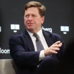 Donald Trump stopped the planned confirmation hearing for his nominee Jay Clayton. The hearing was set to take place before the United States Senate Select Committee on Intelligence. Clayton was expected to begin the approval process to become Director of National Intelligence. That role oversees the country intelligence agencies and advises the president on national security. Reason Behind the Decision Trump said the hearing should not move forward because Congress has not acted on surveillance legislation. He pointed to issues with the Foreign Intelligence Surveillance law, which governs how intelligence agencies collect data from communication companies. He also linked the situation to disagreement over a separate voting bill. He said he would not support the surveillance law unless changes connected to voting rules were included. This move created tension because the two issues are normally handled separately in Congress. Political Reactions Senator Tom Cotton said the hearing was postponed and expressed regret over the delay. He said Clayton is qualified and ready for the role, and he expects the process to continue soon. Senator Mark Warner criticized the decision. He said national security should not depend on social media statements and warned that intelligence decisions should stay separate from political bargaining. What Happens Next Clayton remains the nominee for Director of National Intelligence. The Senate has not set a new date for the hearing. The position oversees 18 intelligence agencies and serves as the main adviser to the president on security matters. The current acting intelligence chief, Bill Pulte, will continue in the role until a permanent leader is confirmed. The previous director, Tulsi Gabbard, is expected to leave office on 30 June.