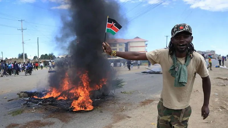 Two killed in Kenya protests over planned US Ebola isolation centre Violence erupts in Nanyuki Two people were killed in Nanyuki, a town in central Kenya, during protests linked to a proposed US Ebola isolation facility near a military base. The demonstrations turned chaotic as crowds blocked roads, burned tyres, and clashed with security forces. Police used tear gas to disperse protesters. One victim was a bystander, family says One of the dead has been identified as 27 year old Charles Mang’aro Mwangi. His family says he was not part of the protest and was simply going about his daily routine when he was shot. His mother, Joyce Wangari, said he had left to meet a friend after work in the evening. She said he was not carrying anything or involved in any confrontation when the shooting happened. The family also said they have not received official details from authorities. Second death still unclear The second victim was taken to hospital by soldiers and was already dead on arrival. Both bodies showed gunshot injuries, but officials have not confirmed how the shootings happened or who was responsible. Police have said they were not aware of any fatalities when asked by reporters, and no formal statement has clarified the incidents. Public anger over Ebola facility plan The protests were triggered by plans to set up a 50 bed Ebola isolation centre at Laikipia Airbase. The facility is expected to treat US citizens affected by an outbreak in the Democratic Republic of Congo and will be staffed by US medical teams. Local concern has grown over possible health risks and cross border infection. Kenya has not reported any Ebola cases so far. Legal challenge halts opening Kenya’s High Court has temporarily stopped the facility from opening after a rights group filed a case. The petition argued that the project could create serious public health risks.