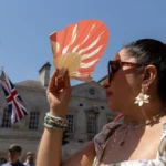 # UK Heatwave Breaks Records as Temperatures Reach 36.7°C The United Kingdom experienced its hottest day of 2026 on Thursday as temperatures climbed to 36.7°C in Somerset. Weather experts have also warned that the country could see its warmest June night ever, with overnight temperatures expected to remain unusually high. According to provisional weather data, Merryfield in Somerset recorded the highest temperature of the day. The figure surpassed previous records and marked the hottest day of June this year. ## Extreme Heat Warning Remains in Effect Authorities have kept a rare red extreme heat warning in place across parts of England and Wales. The alert covers southern, central, and western regions and highlights serious risks linked to prolonged high temperatures. Officials extended the warning for a third consecutive day, the first time such an extension has occurred. Millions of people in London and southeastern England remain affected by the alert. ## Warm Nights Add to Heatwave Challenges The heatwave has created difficult conditions across the country. Many residents struggled to sleep as temperatures stayed exceptionally high overnight. Wednesday night became the warmest June night on record in the UK after temperatures in Cardiff remained above 23.5°C. The previous June record stood at 22.7°C and had been in place since 1976. Forecasters believe Thursday night could challenge or even surpass that record as hot air continues to dominate much of the country. ## Schools, Water Restrictions and Travel Disruption The ongoing heatwave has already caused widespread disruption. Several schools closed because of the extreme conditions, while water companies introduced hosepipe restrictions for some customers in Kent. Transport services also faced delays and disruptions as infrastructure struggled to cope with the intense heat. ## Rain and Thunderstorms Expected Weather conditions are expected to change gradually. Forecasters predict periods of heavy rain across Scotland, moving southeast during the evening. Thunderstorms may also develop in southwestern areas before spreading inland. While these conditions could bring temporary relief, many regions are likely to remain very warm. ## Record Temperatures Across All UK Nations Every nation within the UK recorded its highest temperature of the year on Thursday. England reached 36.7°C in Merryfield, Somerset, setting a new June benchmark for 2026. Wales recorded 35.6°C in Cardiff's Bute Park, making it the hottest June day ever recorded in the nation. The previous June record was 33.7°C. Scotland recorded its highest temperature of the year at 31.2°C in Threave, Dumfries and Galloway. Northern Ireland also experienced its hottest day of 2026, reaching 30.0°C in Castlederg, County Tyrone. ## Heatwave Continues to Grip the UK Meteorologists continue to monitor the situation closely as the heatwave affects millions of people across the country. With temperatures remaining unusually high both day and night, health officials are urging residents to stay hydrated, avoid prolonged sun exposure, and take precautions during the extreme weather conditions.