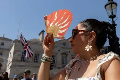 # UK Heatwave Breaks Records as Temperatures Reach 36.7°C The United Kingdom experienced its hottest day of 2026 on Thursday as temperatures climbed to 36.7°C in Somerset. Weather experts have also warned that the country could see its warmest June night ever, with overnight temperatures expected to remain unusually high. According to provisional weather data, Merryfield in Somerset recorded the highest temperature of the day. The figure surpassed previous records and marked the hottest day of June this year. ## Extreme Heat Warning Remains in Effect Authorities have kept a rare red extreme heat warning in place across parts of England and Wales. The alert covers southern, central, and western regions and highlights serious risks linked to prolonged high temperatures. Officials extended the warning for a third consecutive day, the first time such an extension has occurred. Millions of people in London and southeastern England remain affected by the alert. ## Warm Nights Add to Heatwave Challenges The heatwave has created difficult conditions across the country. Many residents struggled to sleep as temperatures stayed exceptionally high overnight. Wednesday night became the warmest June night on record in the UK after temperatures in Cardiff remained above 23.5°C. The previous June record stood at 22.7°C and had been in place since 1976. Forecasters believe Thursday night could challenge or even surpass that record as hot air continues to dominate much of the country. ## Schools, Water Restrictions and Travel Disruption The ongoing heatwave has already caused widespread disruption. Several schools closed because of the extreme conditions, while water companies introduced hosepipe restrictions for some customers in Kent. Transport services also faced delays and disruptions as infrastructure struggled to cope with the intense heat. ## Rain and Thunderstorms Expected Weather conditions are expected to change gradually. Forecasters predict periods of heavy rain across Scotland, moving southeast during the evening. Thunderstorms may also develop in southwestern areas before spreading inland. While these conditions could bring temporary relief, many regions are likely to remain very warm. ## Record Temperatures Across All UK Nations Every nation within the UK recorded its highest temperature of the year on Thursday. England reached 36.7°C in Merryfield, Somerset, setting a new June benchmark for 2026. Wales recorded 35.6°C in Cardiff's Bute Park, making it the hottest June day ever recorded in the nation. The previous June record was 33.7°C. Scotland recorded its highest temperature of the year at 31.2°C in Threave, Dumfries and Galloway. Northern Ireland also experienced its hottest day of 2026, reaching 30.0°C in Castlederg, County Tyrone. ## Heatwave Continues to Grip the UK Meteorologists continue to monitor the situation closely as the heatwave affects millions of people across the country. With temperatures remaining unusually high both day and night, health officials are urging residents to stay hydrated, avoid prolonged sun exposure, and take precautions during the extreme weather conditions.