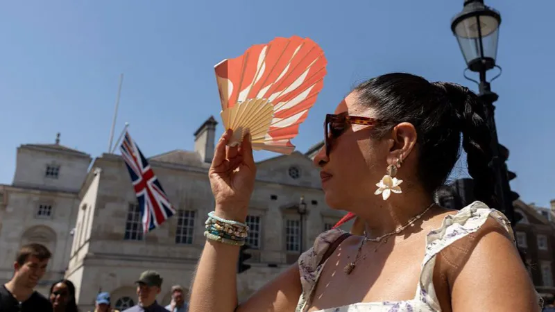 # UK Heatwave Breaks Records as Temperatures Reach 36.7°C The United Kingdom experienced its hottest day of 2026 on Thursday as temperatures climbed to 36.7°C in Somerset. Weather experts have also warned that the country could see its warmest June night ever, with overnight temperatures expected to remain unusually high. According to provisional weather data, Merryfield in Somerset recorded the highest temperature of the day. The figure surpassed previous records and marked the hottest day of June this year. ## Extreme Heat Warning Remains in Effect Authorities have kept a rare red extreme heat warning in place across parts of England and Wales. The alert covers southern, central, and western regions and highlights serious risks linked to prolonged high temperatures. Officials extended the warning for a third consecutive day, the first time such an extension has occurred. Millions of people in London and southeastern England remain affected by the alert. ## Warm Nights Add to Heatwave Challenges The heatwave has created difficult conditions across the country. Many residents struggled to sleep as temperatures stayed exceptionally high overnight. Wednesday night became the warmest June night on record in the UK after temperatures in Cardiff remained above 23.5°C. The previous June record stood at 22.7°C and had been in place since 1976. Forecasters believe Thursday night could challenge or even surpass that record as hot air continues to dominate much of the country. ## Schools, Water Restrictions and Travel Disruption The ongoing heatwave has already caused widespread disruption. Several schools closed because of the extreme conditions, while water companies introduced hosepipe restrictions for some customers in Kent. Transport services also faced delays and disruptions as infrastructure struggled to cope with the intense heat. ## Rain and Thunderstorms Expected Weather conditions are expected to change gradually. Forecasters predict periods of heavy rain across Scotland, moving southeast during the evening. Thunderstorms may also develop in southwestern areas before spreading inland. While these conditions could bring temporary relief, many regions are likely to remain very warm. ## Record Temperatures Across All UK Nations Every nation within the UK recorded its highest temperature of the year on Thursday. England reached 36.7°C in Merryfield, Somerset, setting a new June benchmark for 2026. Wales recorded 35.6°C in Cardiff's Bute Park, making it the hottest June day ever recorded in the nation. The previous June record was 33.7°C. Scotland recorded its highest temperature of the year at 31.2°C in Threave, Dumfries and Galloway. Northern Ireland also experienced its hottest day of 2026, reaching 30.0°C in Castlederg, County Tyrone. ## Heatwave Continues to Grip the UK Meteorologists continue to monitor the situation closely as the heatwave affects millions of people across the country. With temperatures remaining unusually high both day and night, health officials are urging residents to stay hydrated, avoid prolonged sun exposure, and take precautions during the extreme weather conditions.