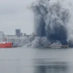 # Ukraine Strikes Cargo Ships in Sea of Azov as Putin Prepares Major Address Ukraine has claimed responsibility for striking five cargo vessels operating in the Sea of Azov and waters near Russian occupied territories. Ukrainian officials say the ships were involved in transporting stolen grain, fuel, and military supplies. The operation comes at a critical moment in the war. Russian President Vladimir Putin is preparing to deliver a major speech at an economic forum in St. Petersburg. The development also follows Ukrainian President Volodymyr Zelensky's recent proposal for direct peace talks with the Russian leader. ## Ukraine Targets Vessels in Occupied Waters According to Ukraine's drone forces commander, the targeted vessels were operating near the ports of Mariupol and Berdyansk. Ukrainian authorities accused the ships of secretly moving cargo from occupied territories. Officials stated that the vessels had removed or concealed identifying markings. They also reportedly switched off radar systems to avoid detection while transporting grain, fuel, and military equipment. Ukraine believes these activities helped support Russia's military operations and the movement of resources from occupied areas. ## Azerbaijan Reports Deaths Following Attacks Azerbaijan's Foreign Ministry confirmed that five Azerbaijani citizens were killed during attacks involving two of the vessels. The ministry identified the ships as the Nastra and the Circon. However, officials did not directly blame any country for the attacks. They also clarified that the vessels were not owned by Azerbaijan. Ukrainian military officials have not reported any casualties related to the operation. ## Naval Drone Explosion Reported Near Romania In a separate incident, Ukraine confirmed that one of its naval drones exploded off Romania's coastline on Friday. Authorities reported no injuries or damage from the blast. The incident has drawn attention because Romania is a member of NATO and shares a border with Ukraine. Officials have not released additional details about the cause of the explosion. ## Zelensky Highlights Pressure on Russia President Zelensky said Russia is feeling the effects of continued Ukrainian attacks on military and energy infrastructure. He argued that drone and missile strikes, fuel shortages, and rising prices have increased pressure on Russian society. Zelensky also renewed his call for direct talks aimed at ending the conflict. Ukraine has regularly targeted strategic facilities inside Russia. Kyiv says these operations are designed to weaken Russia's ability to sustain the war. ## Putin Arrives in St. Petersburg The latest developments come as President Putin arrives in St. Petersburg for a major economic forum. His visit follows a Ukrainian drone attack that reportedly targeted areas on the outskirts of the city a day earlier. The timing highlights the growing intensity of the conflict as both sides continue military operations while discussing the possibility of future negotiations. ## Growing Tensions in the Region The strikes in the Sea of Azov and the drone explosion near Romania demonstrate how the conflict continues to affect multiple regions beyond the main battlefield. With diplomatic efforts still uncertain, military actions remain a central feature of the war. Both Ukraine and Russia continue to pursue strategic objectives while international observers closely monitor developments.