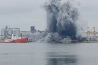 # Ukraine Strikes Cargo Ships in Sea of Azov as Putin Prepares Major Address Ukraine has claimed responsibility for striking five cargo vessels operating in the Sea of Azov and waters near Russian occupied territories. Ukrainian officials say the ships were involved in transporting stolen grain, fuel, and military supplies. The operation comes at a critical moment in the war. Russian President Vladimir Putin is preparing to deliver a major speech at an economic forum in St. Petersburg. The development also follows Ukrainian President Volodymyr Zelensky's recent proposal for direct peace talks with the Russian leader. ## Ukraine Targets Vessels in Occupied Waters According to Ukraine's drone forces commander, the targeted vessels were operating near the ports of Mariupol and Berdyansk. Ukrainian authorities accused the ships of secretly moving cargo from occupied territories. Officials stated that the vessels had removed or concealed identifying markings. They also reportedly switched off radar systems to avoid detection while transporting grain, fuel, and military equipment. Ukraine believes these activities helped support Russia's military operations and the movement of resources from occupied areas. ## Azerbaijan Reports Deaths Following Attacks Azerbaijan's Foreign Ministry confirmed that five Azerbaijani citizens were killed during attacks involving two of the vessels. The ministry identified the ships as the Nastra and the Circon. However, officials did not directly blame any country for the attacks. They also clarified that the vessels were not owned by Azerbaijan. Ukrainian military officials have not reported any casualties related to the operation. ## Naval Drone Explosion Reported Near Romania In a separate incident, Ukraine confirmed that one of its naval drones exploded off Romania's coastline on Friday. Authorities reported no injuries or damage from the blast. The incident has drawn attention because Romania is a member of NATO and shares a border with Ukraine. Officials have not released additional details about the cause of the explosion. ## Zelensky Highlights Pressure on Russia President Zelensky said Russia is feeling the effects of continued Ukrainian attacks on military and energy infrastructure. He argued that drone and missile strikes, fuel shortages, and rising prices have increased pressure on Russian society. Zelensky also renewed his call for direct talks aimed at ending the conflict. Ukraine has regularly targeted strategic facilities inside Russia. Kyiv says these operations are designed to weaken Russia's ability to sustain the war. ## Putin Arrives in St. Petersburg The latest developments come as President Putin arrives in St. Petersburg for a major economic forum. His visit follows a Ukrainian drone attack that reportedly targeted areas on the outskirts of the city a day earlier. The timing highlights the growing intensity of the conflict as both sides continue military operations while discussing the possibility of future negotiations. ## Growing Tensions in the Region The strikes in the Sea of Azov and the drone explosion near Romania demonstrate how the conflict continues to affect multiple regions beyond the main battlefield. With diplomatic efforts still uncertain, military actions remain a central feature of the war. Both Ukraine and Russia continue to pursue strategic objectives while international observers closely monitor developments.