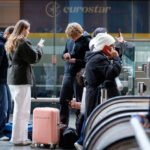 # EU Entry/Exit System Sparks Concerns Over Summer Travel Delays Travellers heading to Europe this summer may experience longer waiting times at airports because of the European Union's new Entry/Exit System (EES). The digital border control program has now become fully operational across the Schengen Area and is changing the way non-EU visitors enter and leave participating countries. Many travel experts have warned that the new checks could create delays during peak holiday periods. As millions of people travel across Europe, airports are preparing for increased passenger processing times. ## What Is the EU Entry/Exit System? The EU Entry/Exit System is a digital border management program designed to replace traditional passport stamping. Instead of receiving a manual stamp, travellers now have their entry and exit information recorded electronically. The system applies to non-EU citizens entering the Schengen Area. This includes UK travellers visiting popular destinations such as France, Spain, Portugal, Italy, Greece, and other participating countries. Officials introduced the system to improve border security and track the movement of visitors more accurately. ## What Information Must Travellers Provide? Under the new rules, travellers must complete biometric registration when entering the Schengen Area for the first time. This process includes: * A passport scan * Fingerprint registration * A digital facial photograph Most passengers complete these checks at automated kiosks located at airports. However, border officers may process some travellers manually. Children under 12 years old are generally exempt from fingerprint collection. Once travellers leave the Schengen Area, authorities verify the stored information to confirm their departure. ## Why Are Airport Delays Expected? The biometric registration process takes longer than a standard passport check. As a result, airport authorities expect increased waiting times, especially during busy travel periods. Since the rollout began last year, several airports have reported smooth operations. However, others have experienced significant delays during peak hours. Travel industry representatives believe some airports could face lengthy queues when passenger numbers rise sharply. In certain cases, travellers may wait several hours before clearing border control. ## What Should Travellers Do Before Flying? Passengers travelling to Europe should arrive at airports earlier than usual and allow extra time for border procedures. Checking airline guidance before departure can also help travellers prepare for any additional requirements. Furthermore, travellers should keep passports ready and follow airport instructions to speed up the registration process. Although the new system aims to strengthen security and modernize border management, it may take time before airports fully adjust to the additional checks. ## Outlook for Summer Travel The EU Entry/Exit System marks a major change in European border control procedures. While authorities expect the system to improve efficiency in the long term, travellers could experience delays during the busy summer season. For now, planning ahead and allowing extra time at airports remains the best way to avoid unnecessary stress and travel disruptions.