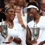 Williams Sisters Secure Wimbledon Doubles Wildcard Return Serena and Venus set for SW19 comeback Serena Williams and Venus Williams are set to return to Wimbledon together after receiving a wildcard entry for the women’s doubles event. The American sisters will compete again at the All England Club, where they have built a strong legacy over the years. Singles wildcard spots remain limited Neither Serena nor Venus has been included in the singles wildcard list so far. However, one spot is still available, leaving the door slightly open for further announcements before the tournament begins. Serena Williams continues comeback journey Serena Williams, now 44, recently returned to competitive tennis at Queen’s. Her appearance came four years after what many believed was her final professional match at the 2022 US Open. She continued her comeback in Berlin this week, partnering with Karolina Muchova. The pair lost 6-4, 6-4 to Giuliana Olmos and Erin Routliffe, who are experienced doubles specialists. Serena has won 23 Grand Slam singles titles, including seven at Wimbledon. She also shares six Wimbledon doubles titles with Venus. Venus Williams still active in doubles Venus Williams, 45, has struggled in singles this season, losing all seven matches she has played. She has shown stronger form in doubles, including a win alongside Britain’s Katie Boulter at the Madrid Open in April. Family influence behind Serena’s return Serena said her return to doubles was partly inspired by Venus’s strong performance in last year’s US Open doubles event. She also mentioned that her daughter, Olympia, encouraged her to team up again with Venus. She admitted she had not originally planned to return to competition at this stage, but the motivation from family and Venus changed her decision. When asked about a possible singles return at Wimbledon, she said she would need more preparation before considering it. Other Wimbledon wildcard updates British player Dan Evans has not received a wildcard for the men’s singles draw, which will mark his final professional appearance. Stan Wawrinka, a three time Grand Slam winner, has been awarded a wildcard as he prepares to retire later this season. Grigor Dimitrov is also included in the main draw through a wildcard entry. French Open runner up Maja Chwalinska has earned a women’s singles wildcard following her strong run in Paris. Wimbledon 2026 schedule Wimbledon is scheduled to begin on Monday, 29 June.