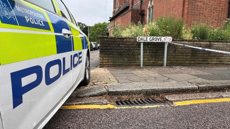 A 19 year old woman has died after gunshots were heard at a residential property in Dale Grove, Finchley, north London, shortly after midnight on Monday. Emergency services attended the scene after a call from the London Ambulance Service. When officers arrived, they found the woman with fatal injuries. She was pronounced dead at the location. Her family has been informed and is receiving support from specially trained officers. Emergency response at the scene Police secured the area soon after arriving at the property. The road was cordoned off while emergency teams worked at the scene. Authorities confirmed that formal identification has not yet taken place. A post mortem examination will be carried out to determine further details about the cause of death. Witness accounts from residents Local residents described shock and concern following the incident. One nearby resident, Geraldine Haren, said she was deeply surprised by what had happened. She described the area as calm and family friendly, adding that the community is close knit and usually peaceful. Another resident, Faz Saj, who lives on the same road with his family, said he returned home to find the street blocked. He said the incident felt unusual for the neighbourhood and expressed disbelief at what had taken place. Police investigation underway Detective Chief Inspector Allam Bhangoo is leading the investigation. He said officers are focused on establishing exactly what happened inside the property. He also expressed sympathy for the victim’s family during what he described as an extremely difficult time. Police confirmed that no arrests have been made so far. Officers are continuing to gather evidence and speak to potential witnesses. Authorities expect an increased police presence in the area over the coming days as enquiries continue. Residents have been encouraged to speak with officers if they have any concerns or information. Community reaction The incident has left the local community in shock. Residents described the neighbourhood as usually quiet and safe, making the sudden violence even more distressing. Many people living nearby said they are struggling to understand how such an event could happen in their area. Next steps in the case Investigators will continue examining forensic evidence and witness statements. A post mortem examination will provide further medical details, which may help clarify the sequence of events. Police have stated that updates will be shared once more verified information becomes available.