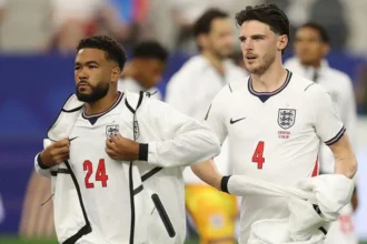 # England Assess Reece James and Declan Rice Ahead of Panama World Cup Match ## Midfield and Defensive Concerns for England England's coaching staff are closely monitoring the fitness of Reece James and Declan Rice before their final World Cup group stage fixture against Panama on Saturday. Both players picked up fitness concerns following England's goalless draw against Ghana. Medical staff will continue evaluating their conditions before making a final decision on their availability. ## Rice Dealing With Calf and Hamstring Issues Declan Rice left Boston Stadium with heavy strapping on his left calf after Tuesday's match. While the injury raised concerns among supporters, sources suggest there is no major threat to his long term participation in the tournament. The England midfielder had already been managing a hamstring problem. During the earlier match against Croatia, he experienced nerve pain linked to that issue and was substituted as a precaution. England's medical team plans to assess Rice's recovery over the coming days. Coaches will then determine whether it is worth risking him against Panama or allowing additional time for recovery. ## Reece James Also Under Observation Reece James completed the full 90 minutes against Ghana, but the defender will also undergo further medical checks. The Chelsea captain has faced several injury setbacks throughout his career. Because of that history, England's staff remain cautious about managing his workload during the tournament. Although James showed no obvious signs of discomfort during the match, coaches want to ensure he remains fully fit for the knockout stages. ## England Prioritising Player Fitness With qualification hopes still in their hands, England's management team must balance immediate results with the long term fitness of key players. Rice remains one of the team's most important midfielders, while James provides valuable experience and defensive strength. Any decision regarding their involvement against Panama will depend on medical assessments and recovery progress. Supporters are expected to receive an official update later this week as England continue preparations for their crucial World Cup encounter. ## What Happens Next? England's medical staff will closely monitor both players over the next 24 to 48 hours. If their recovery progresses well, they could feature against Panama. However, the coaching staff may choose a cautious approach to avoid aggravating any injuries before the knockout rounds begin. The coming days will be important as England look to secure a positive result while keeping their squad healthy for the challenges ahead.