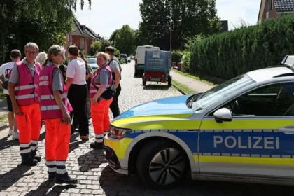 Six Dead After Shooting at Youth Welfare Centre in Germany, Suspect Arrested A tragic shooting at a youth welfare centre in Stade, northern Germany, has left six people dead and several others injured. Authorities arrested the suspected gunman and launched an investigation into what led to the deadly attack. Four Women Among the Victims Police confirmed that four women and one man died inside the welfare centre on Monday afternoon. Another victim later died in hospital after suffering critical injuries. Officials said all six victims were adults. Emergency crews rushed to the scene shortly after the shooting began. Several injured people also received treatment, although authorities have not released their identities or conditions. Large Police Response in Stade The shooting took place at a youth welfare facility on Dankersstrasse in Stade, a city located about 30 kilometres west of Hamburg. Police quickly secured the area and urged residents to stay away while officers carried out their investigation. A large number of police officers, medical teams, and emergency personnel responded to the incident. Authorities later announced that there was no further threat to the public. Suspect in Custody Police arrested the suspected shooter shortly after the attack. Investigators are also examining the possible involvement of two additional individuals. At this stage, officials have not revealed the motive behind the shooting. Detectives continue to gather evidence and interview witnesses to determine exactly what happened. Children Safe During the Incident Local media reports said the welfare centre housed women and children. Officials also confirmed that children at a nearby daycare centre remained inside during the incident for safety reasons. School-aged children in the area were later picked up by their parents after authorities secured the scene. Investigation Continues The city of Stade, home to around 50,000 residents, remains in shock following one of the deadliest incidents in the region in recent years. Investigators are expected to release more information as the inquiry continues. Authorities have asked anyone with information about the shooting to contact police as they work to establish the circumstances surrounding the tragedy.