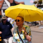 UK Heatwave Warning: Temperatures May Reach 40C as Rare Red Alert Issued Extreme heat alert across England and Wales A rare red weather warning has been issued for parts of England and Wales as an intense heatwave is expected to push temperatures close to 40C later this week. The alert covers London, southern England, the Midlands, and parts of south east Wales. The Met Office has warned that the conditions could cause major disruption and serious health risks. When the heatwave will peak The red warning is in place from Wednesday morning to Thursday night, with the highest temperatures expected during this period. Forecasters say highs could reach 39C to 40C in some areas, especially across southern England. An amber warning is also active across much of central and southern England and most of Wales from Monday through Thursday. Travel disruption and daily life impact Officials expect widespread disruption to transport, schools, and daily routines. Some schools have already announced early closures due to safety concerns. High humidity will make the heat feel even more intense, increasing discomfort and risk for people outdoors or without cooling. Health risks and official warnings Health experts have warned that this level of heat can cause serious illness, especially for older adults, young children, and people with existing health conditions. The UK Health Security Agency has issued a red heat health alert for several regions. It is only the second time such a warning has been used for heat. Dr Agostinho Sousa, a senior health protection official, urged people to take the warning seriously and check on vulnerable family members and neighbours. Night temperatures and tropical nights Temperatures may remain unusually high overnight, staying above 21C to 22C in some areas. These are known as tropical nights and can increase health strain because the body does not cool down properly. How this compares to UK records If temperatures reach 40C, they would come close to the UK’s highest recorded temperature of 40.3C, which was recorded in 2022. That record remains the highest temperature ever measured in the country.