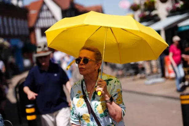 UK Heatwave Warning: Temperatures May Reach 40C as Rare Red Alert Issued Extreme heat alert across England and Wales A rare red weather warning has been issued for parts of England and Wales as an intense heatwave is expected to push temperatures close to 40C later this week. The alert covers London, southern England, the Midlands, and parts of south east Wales. The Met Office has warned that the conditions could cause major disruption and serious health risks. When the heatwave will peak The red warning is in place from Wednesday morning to Thursday night, with the highest temperatures expected during this period. Forecasters say highs could reach 39C to 40C in some areas, especially across southern England. An amber warning is also active across much of central and southern England and most of Wales from Monday through Thursday. Travel disruption and daily life impact Officials expect widespread disruption to transport, schools, and daily routines. Some schools have already announced early closures due to safety concerns. High humidity will make the heat feel even more intense, increasing discomfort and risk for people outdoors or without cooling. Health risks and official warnings Health experts have warned that this level of heat can cause serious illness, especially for older adults, young children, and people with existing health conditions. The UK Health Security Agency has issued a red heat health alert for several regions. It is only the second time such a warning has been used for heat. Dr Agostinho Sousa, a senior health protection official, urged people to take the warning seriously and check on vulnerable family members and neighbours. Night temperatures and tropical nights Temperatures may remain unusually high overnight, staying above 21C to 22C in some areas. These are known as tropical nights and can increase health strain because the body does not cool down properly. How this compares to UK records If temperatures reach 40C, they would come close to the UK’s highest recorded temperature of 40.3C, which was recorded in 2022. That record remains the highest temperature ever measured in the country.