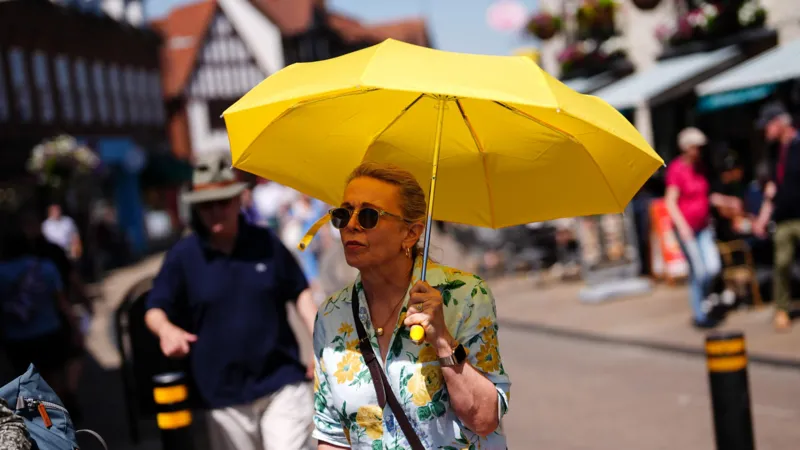 UK Heatwave Warning: Temperatures May Reach 40C as Rare Red Alert Issued Extreme heat alert across England and Wales A rare red weather warning has been issued for parts of England and Wales as an intense heatwave is expected to push temperatures close to 40C later this week. The alert covers London, southern England, the Midlands, and parts of south east Wales. The Met Office has warned that the conditions could cause major disruption and serious health risks. When the heatwave will peak The red warning is in place from Wednesday morning to Thursday night, with the highest temperatures expected during this period. Forecasters say highs could reach 39C to 40C in some areas, especially across southern England. An amber warning is also active across much of central and southern England and most of Wales from Monday through Thursday. Travel disruption and daily life impact Officials expect widespread disruption to transport, schools, and daily routines. Some schools have already announced early closures due to safety concerns. High humidity will make the heat feel even more intense, increasing discomfort and risk for people outdoors or without cooling. Health risks and official warnings Health experts have warned that this level of heat can cause serious illness, especially for older adults, young children, and people with existing health conditions. The UK Health Security Agency has issued a red heat health alert for several regions. It is only the second time such a warning has been used for heat. Dr Agostinho Sousa, a senior health protection official, urged people to take the warning seriously and check on vulnerable family members and neighbours. Night temperatures and tropical nights Temperatures may remain unusually high overnight, staying above 21C to 22C in some areas. These are known as tropical nights and can increase health strain because the body does not cool down properly. How this compares to UK records If temperatures reach 40C, they would come close to the UK’s highest recorded temperature of 40.3C, which was recorded in 2022. That record remains the highest temperature ever measured in the country.