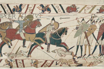 Bayeux Tapestry Returns to UK After 900 Years Under Heavy Security The famous Bayeux Tapestry has arrived in the United Kingdom for the first time in almost 900 years. The historic 11th century artwork reached the British Museum under strict police protection after being transported from northern France. The 70 metre long embroidered masterpiece shows 58 detailed scenes from the events before the Battle of Hastings and the Norman Conquest of England in 1066. The battle changed the future of England and remains one of the most important moments in British history. Historic Arrival at the British Museum The valuable artwork arrived at 02:50 BST in a specially protected transport vehicle. A large secure crate containing the tapestry was carefully removed from the lorry at the British Museum loading area. Museum officials, including British Museum director Nick Cullinan and the French ambassador to the UK, attended the historic arrival. Cullinan described the moment as extraordinary and said the museum was excited to share the rare artwork with visitors from around the world. The exhibition team also expressed their emotions during the arrival. Millie Horton Insch, the project curator for the exhibition, said seeing such an important historical object arrive was a deeply meaningful experience. A Masterpiece From the 11th Century The Bayeux Tapestry is not a traditional painting. It is a detailed embroidery that tells the story of William the Conqueror’s journey and the events that led to the Norman takeover of England. Historians believe the artwork was created shortly after the Battle of Hastings. It provides a unique view of medieval life, warfare, ships, soldiers, and political events from nearly 1,000 years ago. The British Museum will place the tapestry on public display in September, allowing visitors to experience one of the world’s most important historical treasures. France and UK Celebrate Cultural Friendship French President Emmanuel Macron described the loan as a symbol of friendship between France and the United Kingdom. He called it a sign of trust and cooperation between the two countries. To celebrate the occasion, the British Museum displayed a projection of the tapestry on the White Cliffs of Dover with the French message “Merci” as a gesture of appreciation. Concerns Over Moving the Historic Artwork Although many people welcomed the exhibition, some concerns were raised in France about transporting such a fragile object. A French petition argued that moving the tapestry could put the historic item at risk. Some experts and artists also questioned whether the artwork should travel due to its age and delicate condition. Despite these concerns, the Bayeux Tapestry has now safely reached the UK, where it will become one of the most significant historical exhibitions of the year.