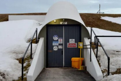 Cold War Bunker in Canada Set for Luxury Doomsday Condo Transformation Former Military Shelter Gets a New Purpose A massive Cold War era bunker in Nova Scotia, Canada, is being transformed into a luxury underground residential complex designed to protect its owners during major global emergencies. The project aims to combine high end living with advanced security, offering a unique option for people looking for a safe retreat during uncertain times. Located about 113 kilometers north of Halifax in the community of Debert, the underground structure was originally built as part of Canada's Cold War defence system. Today, developers believe it can serve a completely different purpose by becoming a secure residential destination for wealthy buyers. Luxury Living Beneath the Ground Canadian entrepreneur Jonathan Baha'i purchased the 64,000 square foot bunker in 2013 for approximately C$31,300. At first, he explored ideas such as historical tours, laser tag activities, and a small data center. However, growing concerns over global instability encouraged the development team to redesign the site as a luxury survival complex. The redevelopment will include 50 private condominium units equipped with premium features. Residents will have access to gourmet meals prepared from a self sustaining food system, biometric security, 24 hour surveillance, onsite medical facilities, and private wellness areas. Additional amenities will include a spa, yoga room, cigar lounge, and modern lighting systems designed to imitate natural daylight. Developers also plan to use an above ground bunker to grow fresh food for residents. Security Designed for Crisis Situations The project will feature advanced security systems to protect residents during emergencies. The development team has partnered with a German security company that specializes in protecting high profile clients. Planned security measures include drone surveillance, controlled entry systems, and continuous monitoring around the property. The nearby Debert Airport will provide convenient access for residents who travel by private aircraft. Condo Owners Can Also Earn Rental Income Developers have already sold several condominium units, although they have not revealed the purchase prices. When owners are away, their units can operate as luxury hotel accommodations, allowing them to earn a share of the rental income. If a real emergency occurs while guests are staying at the property, permanent owners will receive priority access to their units. A Historic Shelter with a Modern Future The Debert bunker was one of several government shelters built across Canada during the Cold War to protect officials in the event of a nuclear attack. Engineers designed the underground facility to survive a nearby nuclear explosion while supporting more than 300 people for at least 30 days. Advances in missile technology eventually reduced the bunker's military value. It later served as an emergency operations center before authorities closed it in 1996. Now, decades later, the historic structure is being reimagined as one of Canada's most unusual luxury real estate developments.