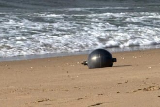 Australia Space Agency Identifies Likely Source of Mystery Space Balls Found on Queensland Beach Residents of northern Queensland were left surprised after six large silver spheres washed up on Forrest Beach near Townsville. At first, no one knew where the objects had come from, leading to widespread curiosity and safety concerns. The Australian Space Agency (ASA) has now identified the most likely source of the mysterious objects. According to the agency, the spheres appear to be pressure vessels from a space launch vehicle. Officials believe the objects are consistent with debris from a foreign rocket that recently re entered Earth's atmosphere. Although investigators have not yet confirmed the exact launch vehicle, the agency is working with international authorities to identify its origin. Authorities Secure the Area Local emergency services quickly responded after the discovery. The Queensland Fire Department created a 50 metre exclusion zone around the objects and warned residents not to approach or touch them. Officials advised anyone who finds a similar object to move away immediately and contact emergency services. Safety experts took extra precautions because the spheres could still contain dangerous substances. Specialist crews wearing protective suits carefully collected the metal balls. They placed them inside hazardous material containers while police secured the area. Authorities wanted to eliminate any possible risk before transporting the objects for further examination. Why Experts Considered the Objects Dangerous Some space experts suggested the spheres could be propellant or pressure tanks from a rocket. If that is correct, they may contain small amounts of highly flammable or chemically reactive materials left over from the launch. Although officials have not confirmed the presence of hazardous chemicals, they continue to treat the objects with extreme caution until testing is complete. Local Community Reacts The discovery quickly became the main topic of conversation in the quiet coastal community. Lisa Scobie, owner of Forrest Beach Takeaway, said unusual events rarely happen in the area. She explained that the arrival of emergency crews and investigators created excitement and curiosity among local residents, who wanted to know where the mysterious objects had come from. Similar Discoveries Have Happened Before This is not the first time space debris has reached Australian shores. In 2023, Indian authorities confirmed that a large metal dome found on a beach in Western Australia belonged to one of the country's Polar Satellite Launch Vehicles (PSLV). A similar metal sphere also appeared in remote grasslands in Namibia in 2011. Experts at that time believed it was a fuel or bladder tank from an unmanned rocket. They suspected it had once contained hydrazine, a highly volatile rocket propellant. Investigation Continues The Australian Space Agency continues to work with international partners to verify the rocket responsible for the debris. Investigators will examine the recovered objects before making a final determination. Until the investigation ends, authorities are asking the public to avoid any unidentified metal objects that could be connected to space launches and report them immediately to emergency services.
