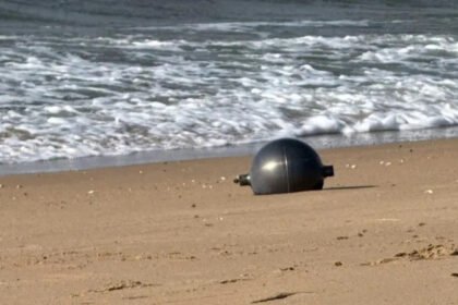 Australia Space Agency Identifies Likely Source of Mystery Space Balls Found on Queensland Beach Residents of northern Queensland were left surprised after six large silver spheres washed up on Forrest Beach near Townsville. At first, no one knew where the objects had come from, leading to widespread curiosity and safety concerns. The Australian Space Agency (ASA) has now identified the most likely source of the mysterious objects. According to the agency, the spheres appear to be pressure vessels from a space launch vehicle. Officials believe the objects are consistent with debris from a foreign rocket that recently re entered Earth's atmosphere. Although investigators have not yet confirmed the exact launch vehicle, the agency is working with international authorities to identify its origin. Authorities Secure the Area Local emergency services quickly responded after the discovery. The Queensland Fire Department created a 50 metre exclusion zone around the objects and warned residents not to approach or touch them. Officials advised anyone who finds a similar object to move away immediately and contact emergency services. Safety experts took extra precautions because the spheres could still contain dangerous substances. Specialist crews wearing protective suits carefully collected the metal balls. They placed them inside hazardous material containers while police secured the area. Authorities wanted to eliminate any possible risk before transporting the objects for further examination. Why Experts Considered the Objects Dangerous Some space experts suggested the spheres could be propellant or pressure tanks from a rocket. If that is correct, they may contain small amounts of highly flammable or chemically reactive materials left over from the launch. Although officials have not confirmed the presence of hazardous chemicals, they continue to treat the objects with extreme caution until testing is complete. Local Community Reacts The discovery quickly became the main topic of conversation in the quiet coastal community. Lisa Scobie, owner of Forrest Beach Takeaway, said unusual events rarely happen in the area. She explained that the arrival of emergency crews and investigators created excitement and curiosity among local residents, who wanted to know where the mysterious objects had come from. Similar Discoveries Have Happened Before This is not the first time space debris has reached Australian shores. In 2023, Indian authorities confirmed that a large metal dome found on a beach in Western Australia belonged to one of the country's Polar Satellite Launch Vehicles (PSLV). A similar metal sphere also appeared in remote grasslands in Namibia in 2011. Experts at that time believed it was a fuel or bladder tank from an unmanned rocket. They suspected it had once contained hydrazine, a highly volatile rocket propellant. Investigation Continues The Australian Space Agency continues to work with international partners to verify the rocket responsible for the debris. Investigators will examine the recovered objects before making a final determination. Until the investigation ends, authorities are asking the public to avoid any unidentified metal objects that could be connected to space launches and report them immediately to emergency services.