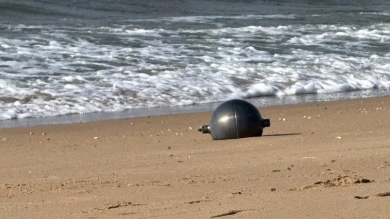 Australia Space Agency Identifies Likely Source of Mystery Space Balls Found on Queensland Beach Residents of northern Queensland were left surprised after six large silver spheres washed up on Forrest Beach near Townsville. At first, no one knew where the objects had come from, leading to widespread curiosity and safety concerns. The Australian Space Agency (ASA) has now identified the most likely source of the mysterious objects. According to the agency, the spheres appear to be pressure vessels from a space launch vehicle. Officials believe the objects are consistent with debris from a foreign rocket that recently re entered Earth's atmosphere. Although investigators have not yet confirmed the exact launch vehicle, the agency is working with international authorities to identify its origin. Authorities Secure the Area Local emergency services quickly responded after the discovery. The Queensland Fire Department created a 50 metre exclusion zone around the objects and warned residents not to approach or touch them. Officials advised anyone who finds a similar object to move away immediately and contact emergency services. Safety experts took extra precautions because the spheres could still contain dangerous substances. Specialist crews wearing protective suits carefully collected the metal balls. They placed them inside hazardous material containers while police secured the area. Authorities wanted to eliminate any possible risk before transporting the objects for further examination. Why Experts Considered the Objects Dangerous Some space experts suggested the spheres could be propellant or pressure tanks from a rocket. If that is correct, they may contain small amounts of highly flammable or chemically reactive materials left over from the launch. Although officials have not confirmed the presence of hazardous chemicals, they continue to treat the objects with extreme caution until testing is complete. Local Community Reacts The discovery quickly became the main topic of conversation in the quiet coastal community. Lisa Scobie, owner of Forrest Beach Takeaway, said unusual events rarely happen in the area. She explained that the arrival of emergency crews and investigators created excitement and curiosity among local residents, who wanted to know where the mysterious objects had come from. Similar Discoveries Have Happened Before This is not the first time space debris has reached Australian shores. In 2023, Indian authorities confirmed that a large metal dome found on a beach in Western Australia belonged to one of the country's Polar Satellite Launch Vehicles (PSLV). A similar metal sphere also appeared in remote grasslands in Namibia in 2011. Experts at that time believed it was a fuel or bladder tank from an unmanned rocket. They suspected it had once contained hydrazine, a highly volatile rocket propellant. Investigation Continues The Australian Space Agency continues to work with international partners to verify the rocket responsible for the debris. Investigators will examine the recovered objects before making a final determination. Until the investigation ends, authorities are asking the public to avoid any unidentified metal objects that could be connected to space launches and report them immediately to emergency services.