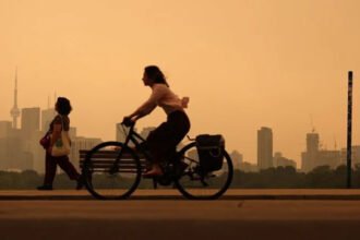 A freight train crew escaped safely after being surrounded by wildfires in Ontario. Smoke from hundreds of Canada wildfires is spreading