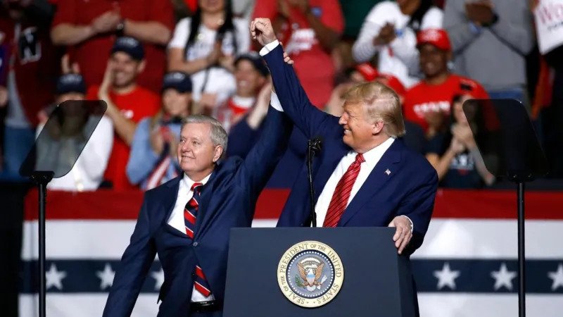 Lindsey Graham, a longtime Republican senator from South Carolina, has died at the age of 71 after a brief illness. His more than two decade career in the US Senate reflected the major changes within the Republican Party during the rise of Donald Trump. Graham built his political identity around several key issues, including a strong national security approach, support for Israel, opposition to Iran’s government, and efforts to limit Russia’s influence around the world. After winning his Senate seat in 2002, Graham became a close ally of Senator John McCain. Like McCain, he was known as a conservative politician who sometimes worked across party lines. From Trump Critic to Close Political Ally During his 2015 presidential campaign, Graham promoted cooperation between Republicans and Democrats. He often spoke about reducing political divisions and finding solutions through discussion. However, his relationship with Donald Trump changed dramatically. During the 2016 Republican primary, Graham strongly criticised Trump after Trump attacked John McCain’s military service. Graham called Trump’s comments unacceptable and questioned his ability to lead the country. The conflict became personal when Trump shared Graham’s phone number at a rally, leading to a flood of angry messages toward the senator. Later, Graham continued his criticism and described Trump as a divisive figure. He also warned that choosing Trump as the Republican nominee could damage the party. Graham’s Shift After Trump Won the Presidency After Trump won the 2016 presidential election, Graham changed his approach. He became one of Trump’s strongest supporters in the Senate. The two politicians developed a close relationship and often spent time together, including playing golf. Graham also became a frequent defender of Trump’s policies during television appearances and political debates. One of Graham’s most notable moments came during the confirmation of Supreme Court nominee Brett Kavanaugh. Graham strongly defended Kavanaugh during the confirmation process after allegations of sexual misconduct were made against him. Kavanaugh denied the allegations and later secured Senate approval. A Complex Political Legacy Although Graham supported Trump for much of his presidency, he did not fully agree with him on every issue. After Trump lost the 2020 election to Joe Biden, Graham briefly separated himself from some of Trump’s claims about the election results. Throughout his Senate career, Lindsey Graham remained a significant figure in American politics. His journey showed the changing direction of the Republican Party and highlighted how politicians adapted to the powerful influence of the Trump era. His supporters viewed him as a skilled political strategist, while critics questioned his shift from a Trump opponent to one of his closest allies. Graham’s legacy will be remembered as a story of political change, compromise, and survival during one of the most transformative periods in modern American politics.