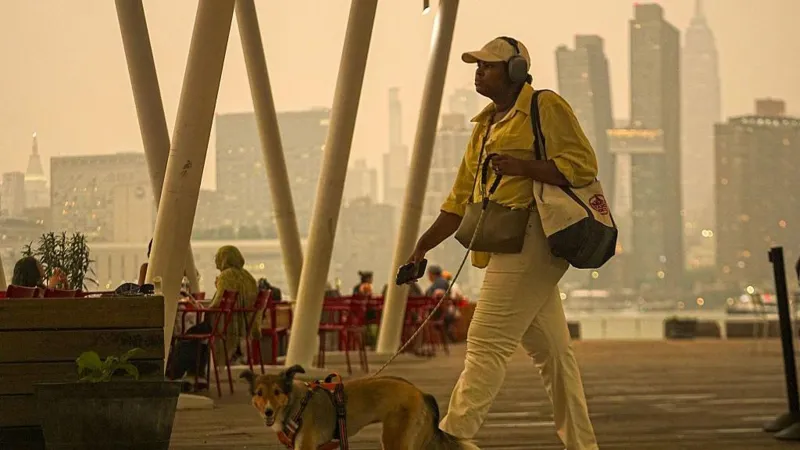 Canada Wildfires Trigger Air Quality Alerts Across the United States More than 800 wildfires continue to burn across Canada, sending thick smoke across the border and causing dangerous air quality in several parts of the United States. Officials have issued health alerts as smoke affects millions of people from the Upper Midwest to the Northeast. Over 800 Wildfires Continue to Burn Canada is currently battling 857 active wildfires, including more than 20 new fires reported in a single day. Most of these fires remain out of control, making it difficult for firefighters to slow their spread. Large wildfire clusters in northwestern Ontario continue to produce massive smoke clouds. These smoke plumes are drifting across nearby provinces and into several US states. Smoke Causes Dangerous Air Quality Smoke from the fires has created hazardous air quality across northern Michigan and Minnesota. Health officials advise residents to stay indoors, keep windows closed, and avoid outdoor activities whenever possible. Air quality alerts also cover parts of the Great Lakes region, the Upper Midwest, and the northeastern United States. In western New York, air pollution has reached a "very unhealthy" level. Meanwhile, the New York City metropolitan area is experiencing "unhealthy" air conditions. Residents have reported hazy skies along with deep orange and red sunrises and sunsets as wildfire smoke spreads through the atmosphere. New York Activates Emergency Measures New York City has expanded its emergency response by opening cooling centers and distributing KN95 face masks. Local officials encourage people, especially children, older adults, and those with breathing conditions, to reduce outdoor exposure until air quality improves. Rain May Bring Only Limited Relief Thunderstorms are expected across parts of Ontario during the next few days. However, weather experts believe the rainfall will likely provide only limited help because many fires continue to burn over large areas. Strong northwesterly winds are expected to push smoke into northern US states through the weekend. As a result, smoke may also reach New Jersey, where large public events are scheduled. Meteorologists expect wind patterns to shift early next week. If that happens, more smoke will move toward Quebec, allowing air quality to improve across many southern US regions. Detroit Records the World's Worst Air Quality According to global air quality monitoring data, Detroit currently has the poorest air quality in the world. Minneapolis and Toronto also rank among the cities experiencing the highest levels of air pollution because of wildfire smoke. Political Leaders Respond Several lawmakers from Michigan have urged the Canadian government to strengthen wildfire prevention and forest management efforts. They expressed concern that smoke has affected their state for three consecutive wildfire seasons. At the same time, US Ambassador to Canada Pete Hoekstra praised the long standing cooperation between both countries. He said the United States and Canada will continue working together to respond to cross border wildfire emergencies. Ongoing Health Concerns Wildfire smoke contains tiny particles that can enter the lungs and worsen breathing problems. Health experts recommend limiting outdoor activities, using air purifiers when available, and wearing high quality masks if outdoor travel becomes necessary. Officials continue to monitor wildfire activity closely as emergency crews work to contain the fires and protect affected communities.