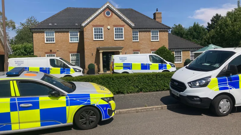 A murder investigation is underway after a mother and her two children were found dead inside a home in Great Denham, a residential area near Bedford. Police discovered the victims after forcing entry into the property when relatives and neighbours became concerned because the family had not been seen for several days. The tragic discovery has shocked the local community. Detectives are now working to establish the exact circumstances surrounding the deaths while carrying out a detailed investigation. Police Respond After Family Goes Missing Officers attended a property on Carnoustie Drive on Monday following reports that the family had not been seen for several days. After entering the home, police found the bodies of a woman and her two children. Emergency services secured the area while specialist investigators began gathering evidence. Forensic teams continue to examine the property as detectives interview witnesses and collect information that could help the investigation. Police Identify Suspect Investigators have confirmed that they identified a suspect who was known to all three victims. Early findings suggest the suspect has already left the country. Police officers are working with national and international agencies to trace the individual and determine their current location. Authorities have not released the suspect's identity because the investigation remains active. Investigation Continues Assistant Chief Constable John Murphy described the case as deeply distressing and confirmed that investigators believe the mother and her two children were murdered. He said the investigation remains in its early stages and requires significant resources. Detectives are examining evidence, reviewing information, and following every possible lead to establish what happened and identify everyone involved. Increased Police Presence in Great Denham Police have reassured residents that there is no evidence of any wider threat to the public. Even so, officers have increased patrols across Great Denham to provide reassurance and maintain a visible presence in the area. Local residents can expect to see more uniformed officers while detectives continue their inquiries. Authorities have urged anyone with information that may assist the investigation to contact the police. Community Shocked by Tragic Incident The deaths of the mother and her two children have deeply affected the Great Denham community. As investigators continue their work, police remain focused on uncovering the full circumstances surrounding the case and bringing the person responsible to justice. The investigation is ongoing, and further updates are expected as new information becomes available.