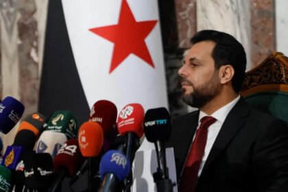 # Syria’s New Parliament Takes Shape as President Ahmed al Sharaa Appoints Final 70 Lawmakers Syria has completed the formation of its new transitional parliament after Interim President Ahmed al Sharaa appointed the remaining 70 lawmakers. The move completes the 210 seat People's Assembly and prepares the legislature for its first session next week. The appointments mark another step in Syria's political transition after the fall of former President Bashar al Assad in 2024. Officials say the new parliament will guide the country's legislative work during the transitional period. ## Final Appointments Complete the Assembly The president selected the final 70 lawmakers after regional electoral colleges had already chosen the other 140 members last October. Officials designed the latest appointments to improve representation across different sections of Syrian society. Among the newly appointed lawmakers, 15 are women. Another 13 members spent time in prison during the rule of Bashar al Assad. The government has not confirmed how many members belong to Syria's religious and ethnic minority communities. Mohammed Taha al Ahmed, chairman of the Higher Committee for the Syrian People's Assembly Elections, said the appointments combine experience with the sacrifices made by many Syrians during years of conflict. ## Parliament Aims to Represent Different Communities According to election officials, the new lawmakers include academics, professionals, community leaders, experts, survivors of detention, relatives of people killed during the war, and victims of chemical attacks. The appointments also cover all 14 Syrian provinces. Two of the newly selected lawmakers come from Suweida, a province with a large Druze population. Officials believe this broader representation will strengthen national unity and ensure that different voices take part in the country's political transition. ## Delays Continue in Some Areas Authorities have not held electoral college voting in Suweida because security conditions remain unstable. The province has stayed outside full government control since deadly sectarian clashes last July left around 1,700 people dead. Election officials said they plan to organize voting there once conditions improve. Authorities also delayed elections in parts of Raqqa and Hassakeh after government forces regained control of those areas from the Kurdish led Syrian Democratic Forces earlier this year. ## Critics Question the Electoral Process Several Kurdish political parties rejected the lawmakers selected through the electoral colleges. They argued that the process excluded important political groups and failed to provide fair representation. Civil society organizations also raised concerns about the structure of the elections. They said the president's influence over the Higher Committee and electoral colleges limits the independence of the parliament. The groups also questioned the president's authority to appoint one third of the assembly and replace lawmakers if seats become vacant. They warned that these powers could reduce the parliament's independence. ## UN Calls the Transition a Critical Moment The United Nations continues to monitor developments in Syria. Last week, UN Deputy Special Envoy Claudio Cordone told the Security Council that the country's transition has reached a critical stage. He said Syria now faces both important opportunities and serious challenges as it works toward political stability and long term peace. The new parliament is expected to begin its first session next week. Its decisions could play an important role in shaping Syria's future during the country's ongoing transition.