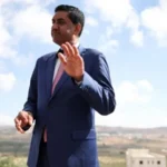 US Democrat Ro Khanna Says He Was Detained by Armed Israeli Settlers in West Bank Ro Khanna’s West Bank Visit Turns Into Detention Incident US Congressman Ro Khanna said he was detained for around 90 minutes by armed Israeli settlers during a visit to the occupied West Bank. Khanna said the incident happened on Wednesday while he was travelling with his team near Turmus Ayya, close to Ramallah. According to his statement, several settlers carrying M4 rifles surrounded their vehicle and blocked their movement. The congressman said the situation continued even after Israeli forces arrived. He claimed that the soldiers supported the settlers instead of helping his group leave the area. Khanna Describes Encounter With Armed Settlers In a statement shared on social media, Khanna said he was visiting the ruins of Khirbet Zanuta as part of a fact finding trip. He wanted to examine the effects of Israeli occupation and the impact on Palestinian communities. Khanna said the area had suffered major damage, including the destruction of a village school. He claimed that armed settlers arrived and stopped their vehicle while they were inspecting the location. During the detention, Khanna’s team contacted the US Embassy in Jerusalem for assistance. He said they were released later after police officers arrived and helped end the situation. Israeli Military Responds to Claims The Israeli military said troops and police officers responded after receiving reports that settlers had blocked vehicles in the area. According to the military, officers arrived at the scene, separated the Israeli civilians, and allowed the vehicles to continue their journey. The military has not accepted Khanna’s description of the incident and said its forces acted to resolve the situation. Background of West Bank Settlements Israel has established around 160 settlements in the West Bank and East Jerusalem, where approximately 700,000 Jewish settlers live. Palestinians consider these areas part of a future independent state. Around 3.3 million Palestinians also live in the West Bank alongside these settlements. Many countries and international organizations consider Israeli settlements in the occupied West Bank illegal under international law, while Israel disputes this position. Political Future of Ro Khanna Ro Khanna, a Democratic member of the US House of Representatives, has gained attention for his views on foreign policy issues. He is also considered a possible candidate for the 2028 US presidential race. The incident during his West Bank visit has added further attention to discussions about Israeli settler activity, Palestinian communities, and US involvement in the region.