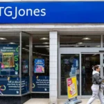 Up to 150 TG Jones Stores to Close After Court Approves Rescue Plan Court Approves Major Restructuring Plan TG Jones, the former WH Smith High Street business, has received court approval for a major restructuring plan that could lead to the closure of up to 150 stores across the UK. The decision is part of a wider effort to reduce costs and improve the company's long term financial position. The retailer currently operates 451 stores and employs around 4,700 people. However, the approved restructuring is expected to reduce the network to around 302 locations, depending on agreements with landlords. Why the Company Is Closing Stores Investment firm Modella Capital purchased the High Street business last year and later rebranded it as TG Jones. The travel division, which operates in airports and railway stations, remained under WH Smith and was not included in the sale. According to the company, the business has struggled because of difficult retail conditions, years of limited investment in stores, and the loss of the well known WH Smith brand name. These factors have contributed to declining sales and increased financial pressure. Company representatives told the court that TG Jones was facing an urgent cash shortage and needed immediate action to avoid insolvency. Without the restructuring plan, the retailer risked running out of money within days. Rent Cuts and Store Closures As part of the rescue package, around 120 landlords will not receive rent for up to three years. In addition, hundreds of other stores will receive rent reductions ranging from 15% to 75%. Modella Capital believes these savings will help stabilize the business and allow future investment in stores that remain open. The company says the plan gives TG Jones the best chance of returning to a stronger financial position. Landlords and Suppliers Raise Concerns Several landlords and suppliers opposed the restructuring plan, arguing that it placed an unfair financial burden on them. British Land was among the most vocal opponents during the legal process. Following further negotiations and several changes to the proposal, British Land withdrew its objections. Even so, many suppliers are still expected to face financial losses under the approved plan. Judge Gives Final Approval The High Court reviewed whether the restructuring would leave creditors in a better position than placing the company into administration. After considering the evidence, the judge approved the proposal. In his decision, Mr Justice Hildyard described the restructuring as both complex and far reaching. He concluded that the plan offered the most practical solution for preserving the business while avoiding a more damaging insolvency process.
