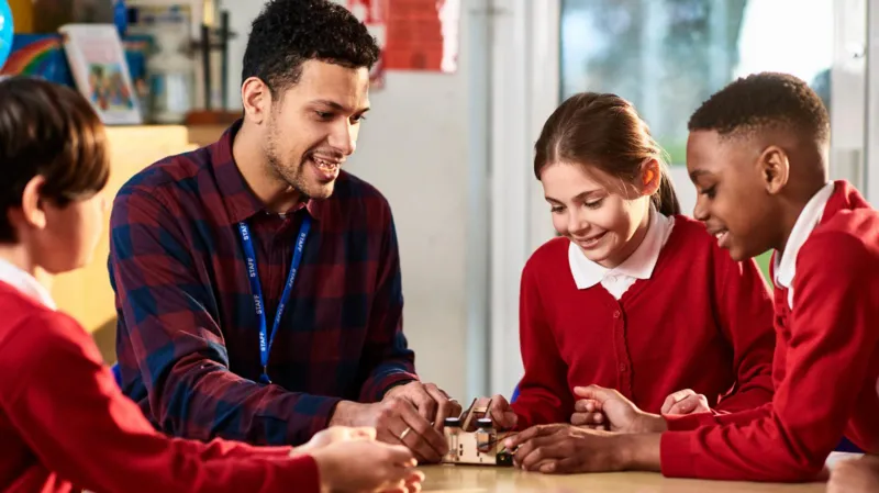 Teachers in England to Receive 3.5% Pay Rise From September Teachers across England will receive a 3.5% pay rise from September, with another 3% increase planned for the following year, according to the Department for Education. The government says the decision reflects its commitment to supporting teachers while also providing additional funding for schools. The government has allocated £1.8 billion in extra funding for education. However, schools will need to cover the first 1% of each pay increase from their existing budgets. Officials believe this approach will help balance higher salaries with responsible public spending. Government Introduces New Rules on Academy Executive Pay Alongside the pay announcement, the government has introduced new measures to limit the salaries of senior leaders in academy trusts. From September, academy trusts must seek government approval before advertising executive roles with salaries above £174,000. In addition, academy executives will no longer be allowed to receive pay rises that exceed those given to classroom teachers. Education Secretary Bridget Phillipson said teachers deserve fair recognition for the work they do every day. She also said executive salaries should not grow faster than teachers' pay and explained that the new rules will help prevent excessive pay increases for senior leaders. Teaching Union Still Considering Strike Action Despite the pay award, the National Education Union (NEU) has not ruled out industrial action. The union had previously warned that it would hold a formal strike ballot in the autumn if the government failed to improve its original pay proposal. Following the latest announcement, an NEU spokesperson said the union is still reviewing its options. General Secretary Daniel Kebede argued that the pay increase does not fully address the financial pressure facing schools. He said schools will still have to find part of the funding from their existing budgets, which could lead to spending cuts in other areas. According to Kebede, the union believes education should receive full funding instead of asking schools to absorb additional costs. The NEU's national executive committee is expected to meet next week to decide its next steps. Former Teacher Says Wellbeing Is the Bigger Challenge Former primary school teacher Jessica Featonby, who now runs an education technology company, welcomed higher salaries but said pay alone will not solve the challenges facing the profession. She explained that many teachers regularly work early mornings, evenings, weekends, and even school holidays without additional pay. In her view, reducing workload and improving staff wellbeing are just as important as increasing salaries. Featonby believes better working conditions would encourage more teachers to stay in the profession and help schools improve long term staff retention. What the Pay Rise Means The latest pay settlement offers teachers a higher salary over the next two years while introducing tighter controls on executive pay in academy trusts. However, concerns remain over how schools will fund part of the increase, leaving ongoing debate between the government and teaching unions about the future of education funding in England.