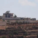 Israeli settlers besieging Palestinian families in West Bank village
