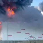 In recent weeks, the company often referred to as the “Russian Amazon” has been targeted by Ukraine. Local officials said that an industrial location around 69 kilometers (43 miles) south of the Kremlin had at least five fatalities and ten injuries. Although they did not confirm that the plant was managed by Wildberries. Officials in the St. Petersburg and Tver areas confirmed that two additional Wildberries locations were affected. Moscow disputes Kyiv’s claim that the depots serve the Russian military. 320 drones were intercepted and destroyed overnight, according to Russia’s defense ministry. Wildberries Warehouse Catches Fire At an industrial complex in Chekhov on the outskirts of Moscow, a warehouse was struck and set fire, according to Moscow area governor Andrei Vorobyov. An electrical substation and an administration building were also destroyed. He stated on Telegram that one of the ten injured individuals was in a severe condition, while the other seven were in a moderate condition. A Wildberries facility close to St. Petersburg is emitting smoke.The warehouse location was connected to Wildberries. It was identified as being connected to the business on the Yandex search engine in Russia. The corporation acknowledged that their plant in the St. Petersburg area was struck. Wildberries Warehouse Destroyed by Drones The Reuters news agency confirmed a social media video that depicted a burning Wildberries warehouse with a massive plume of black smoke emanating from it. A Wildberries factory was also destroyed overnight, according to the Tver region’s governor. Reuters Black smoke and massive flames emerge from a warehouse that resembles other Wildberries facilities. In the St. Petersburg area, smoke rises from a Wildberries warehouse. According to Russian state news agency Tass, local authorities in the Samara area confirmed on Tuesday that all of the commodities housed in a Wilberries warehouse that was struck by Ukrainian drones on Sunday had been destroyed. Wildberries Warehouse Destroyed by Drones The Reuters news agency confirmed a social media video that depicted a burning Wildberries warehouse with a massive plume of black smoke emanating from it. A Wildberries factory was also destroyed overnight, according to the Tver region’s governor. Reuters Black smoke and massive flames emerge from a warehouse that resembles other Wildberries facilities. According to Russian state news agency Tass, local authorities in the Samara area confirmed on Tuesday that all of the commodities housed in a Wilberries warehouse that was struck by Ukrainian drones on Sunday had been destroyed. Russian Strike Kills Three Civilians A hit on a Sumy residential neighborhood claimed the lives of a lady and two kids, ages five and ten, and injured four others, according to the report. According to the State Emergency Service, two persons were also hurt by Russian strikes in the city of Bilhorod-Dnistrovskyi, while a food warehouse in Dnipro caught fire. It occurs one day after a drone struck a crowded beach in southern Russia, killing seven people and wounding fifty eight. A drone crashes and explodes on a beach in the Krasnodar area while holidaymakers watch from the shore and in the ocean. Beach Drone Strike Sparks Dispute While eyewitnesses were cited by Russian media as stating shooting preceded the explosion, suggesting that air defenses may have attempted to shoot the drone down. Several Ukrainian Telegram groups have claimed it fell onto the beach due to electronic warfare that blocked the drone’s signal. Ukraine was charged with “a deliberate strike on civilians” by the regional governor of the area. Ukraine has not responded. Beach Drone Strike Sparks Dispute