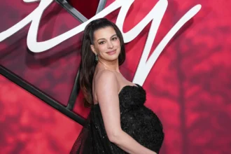 Anne Hathaway attends the New York premiere of Verity in a black Prabal Gurung gown.