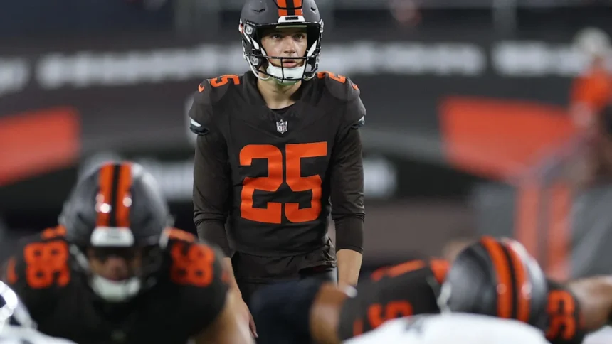 Andre Szmyt kicks the winning field goal during the Browns Steelers game