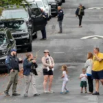 Homeland Security officers outside Representative Ilhan Omar’s Washington residence during a federal search on October 12, 2026.