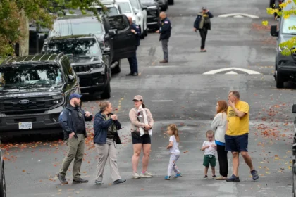 Homeland Security officers outside Representative Ilhan Omar’s Washington residence during a federal search on October 12, 2026.