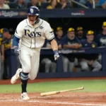 Tampa Bay Rays players celebrate after scoring the winning run against the Milwaukee Brewers.